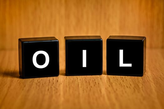 oil text on black block , business concept