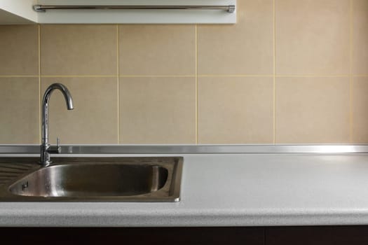 steel stylish sink in a modern kitchen and blank copy space