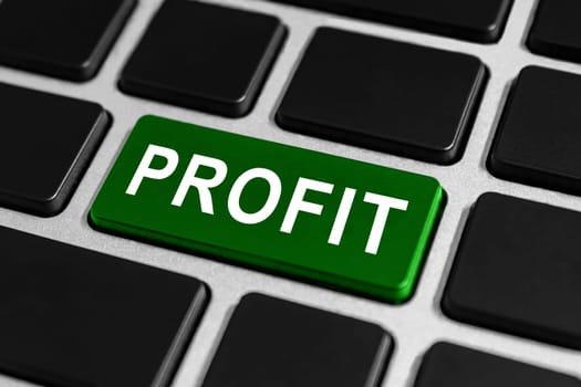 green profit button on keyboard, business financial concept