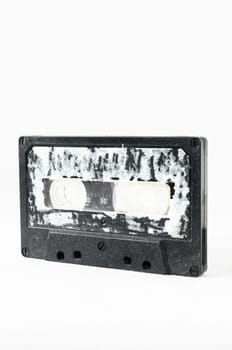 Ancient Vintage Used Musicassette over a White Background