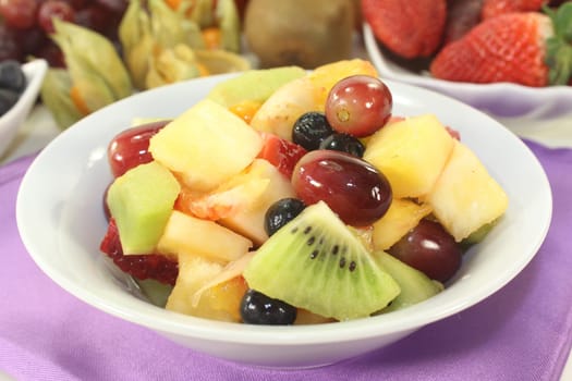 a white bowl with fresh fruit