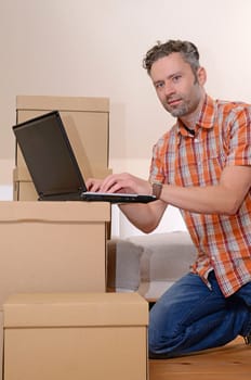 Happy man moving in new home