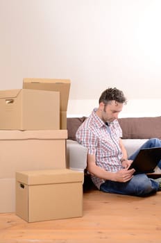 Happy man moving in new home