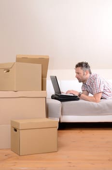 Happy man moving in new home