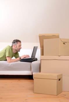 Happy man moving in new home