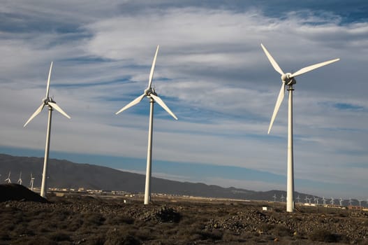 Eletric Power Generator Wind Turbine over a Cloudy Sky