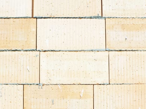 wall of small bricks stones as a background