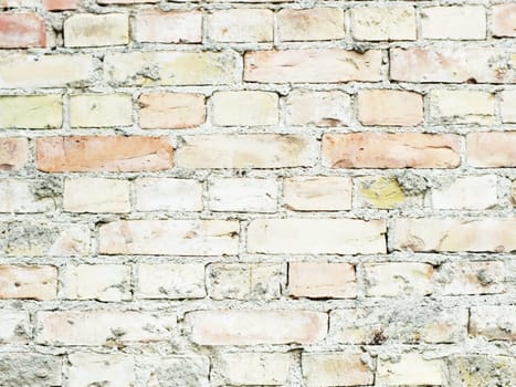 wall of small bricks stones as a background