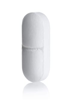 White tablet standing on white background,with reflection