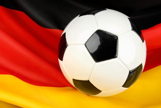 Football on a beautifully hanging German flag