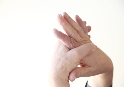 closeup of a man massaging his aching hand