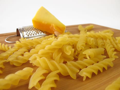 Noodles with small grater and a corner of cheese