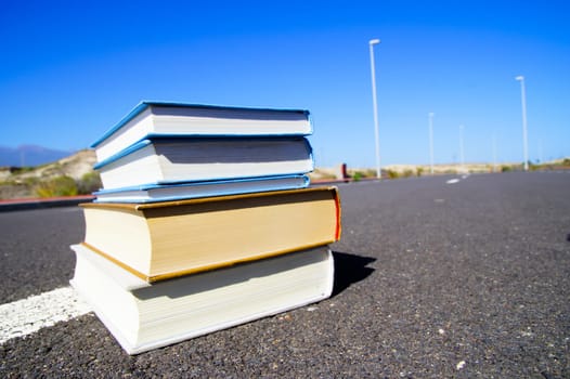 On the Road Literature Concept Books over Asphalt