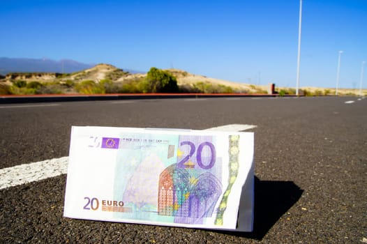 Business Money Concept Banknotes(paper) on the Asphalt Street