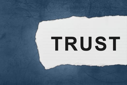 trust with white paper tears on blue texture