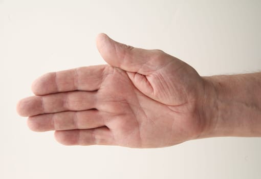 senior man extends his right hand