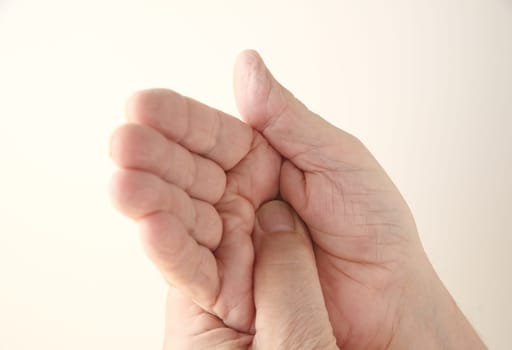 older man with pain in his palm