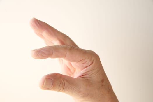 a man's hand indicating smallness or largeness