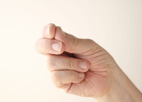 older man uses a gesture of finger snapping