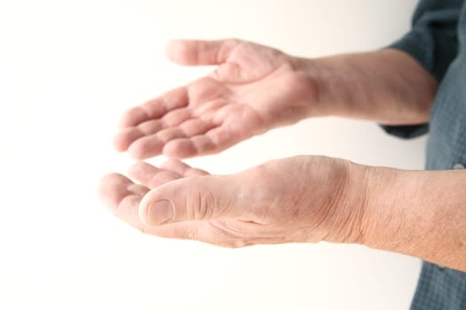 older man using non-verbal communication