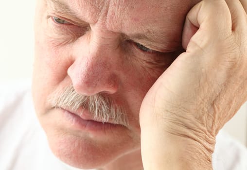 senior man with an unhappy expression