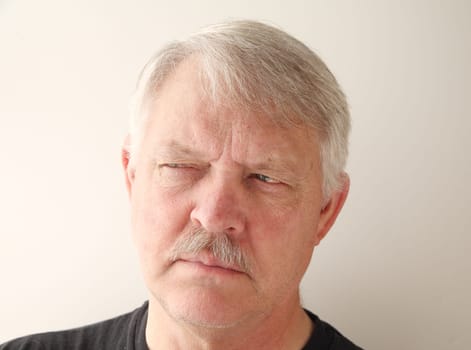 senior with a suspicious expression