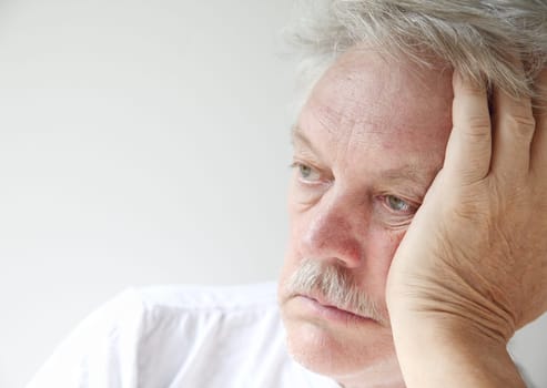 senior man gazes into the distance