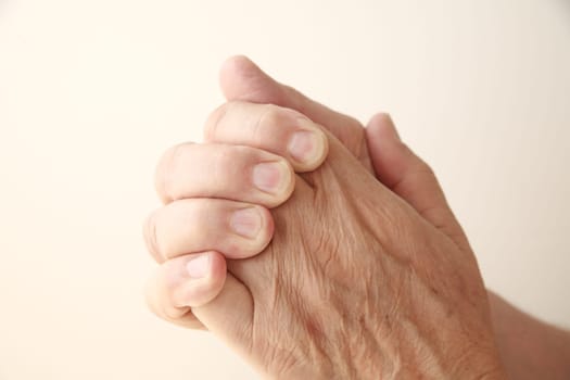 senior man with hands together