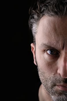 Sceptical man on a black background