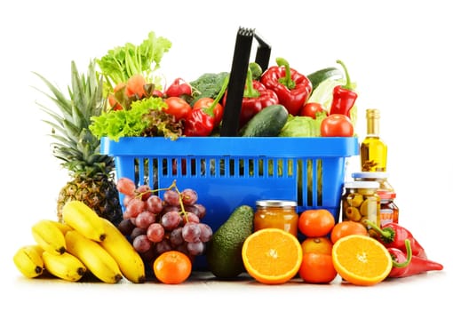 Plastic shopping basket with groceries isolated on white background