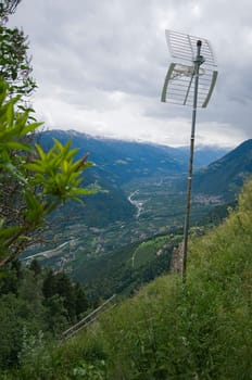 View of the Merano valley from above the hochmuth mountain station with antenna in the foreground