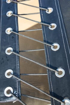 Canvas lashed together with nylon cord on a yacht