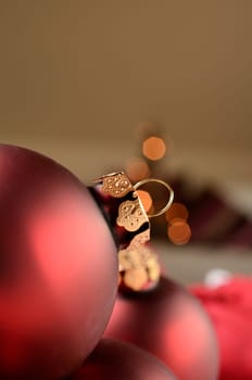Red Christmas baubles on a blurred background