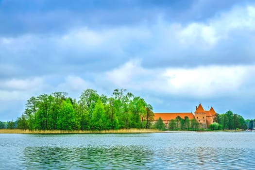 Panoramic view on Medieval old castle in Trakai, Lithuania placed on Galve lake..Island ancient castle are one of the most popular touristic destinations and cultural center in Lithuania.