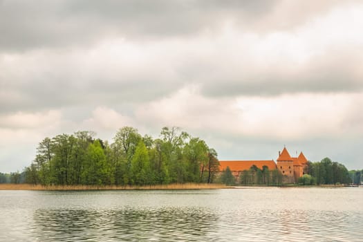Panoramic view on Medieval old castle in Trakai, Lithuania placed on Galve lake..Island ancient castle are one of the most popular touristic destinations and cultural center in Lithuania.