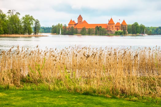 Panoramic view on Medieval old castle in Trakai, Lithuania placed on Galve lake..Island ancient castle are one of the most popular touristic destinations and cultural center in Lithuania.