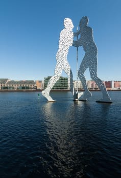 Molecule Men in front of office buildings on the Spree