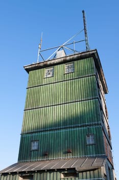 Green spire of a weather observation tower on the Inselsberg