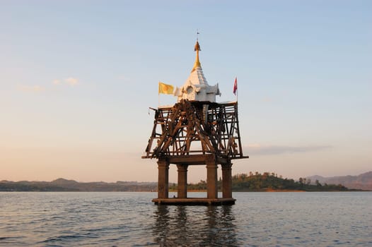 Top of roof of ancient temple flooded by a dam in Sangkhlaburi, Karnchanaburi, Thailand