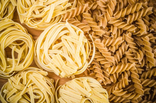 Raw tagliatelle close-up background