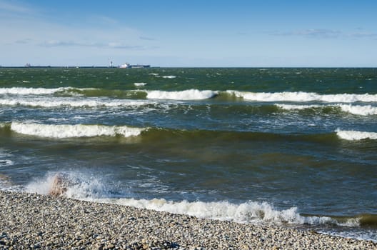 Sea waves lapping on the shore. Baltic Sea.