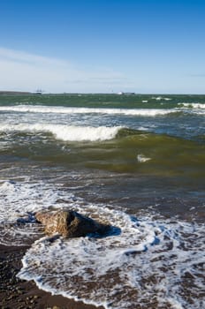 Sea waves lapping on the shore. Baltic Sea.