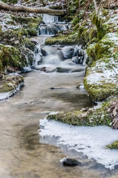 Small creek with a waterfall close up