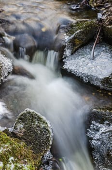 Small creek with a waterfall close up