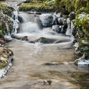 Small creek with a waterfall close up