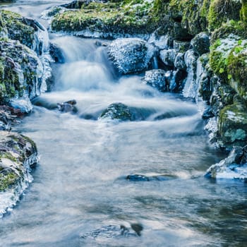 Small creek with a waterfall close up