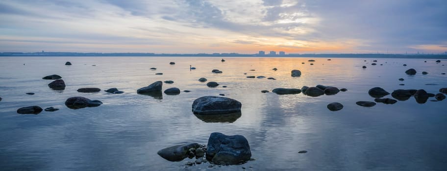 Beautiful sunrise on the sea. Views of Tallinn.