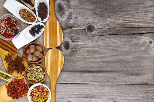 Various spices on rustic board