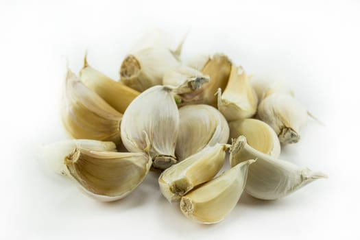 Garlic and garlic bulb on white background