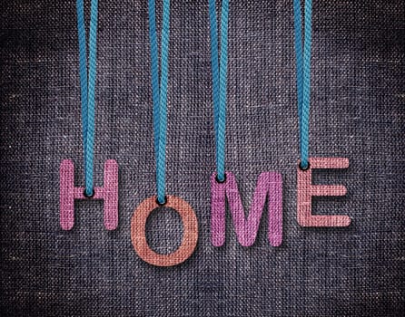 Home Letters hanging strings with blue sackcloth background.